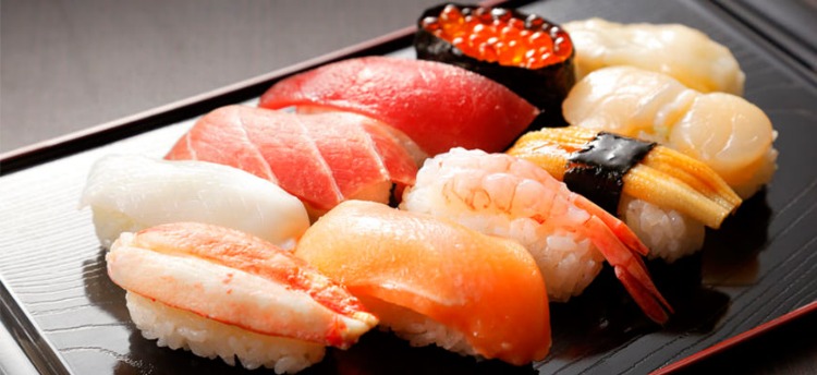 A plate of assorted nigiri sushi